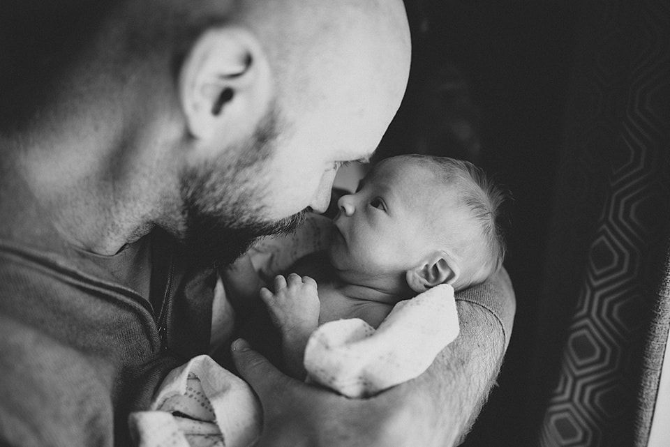 Father-son moment during a lifestyle newborn session - Charlottesville newborn photographer