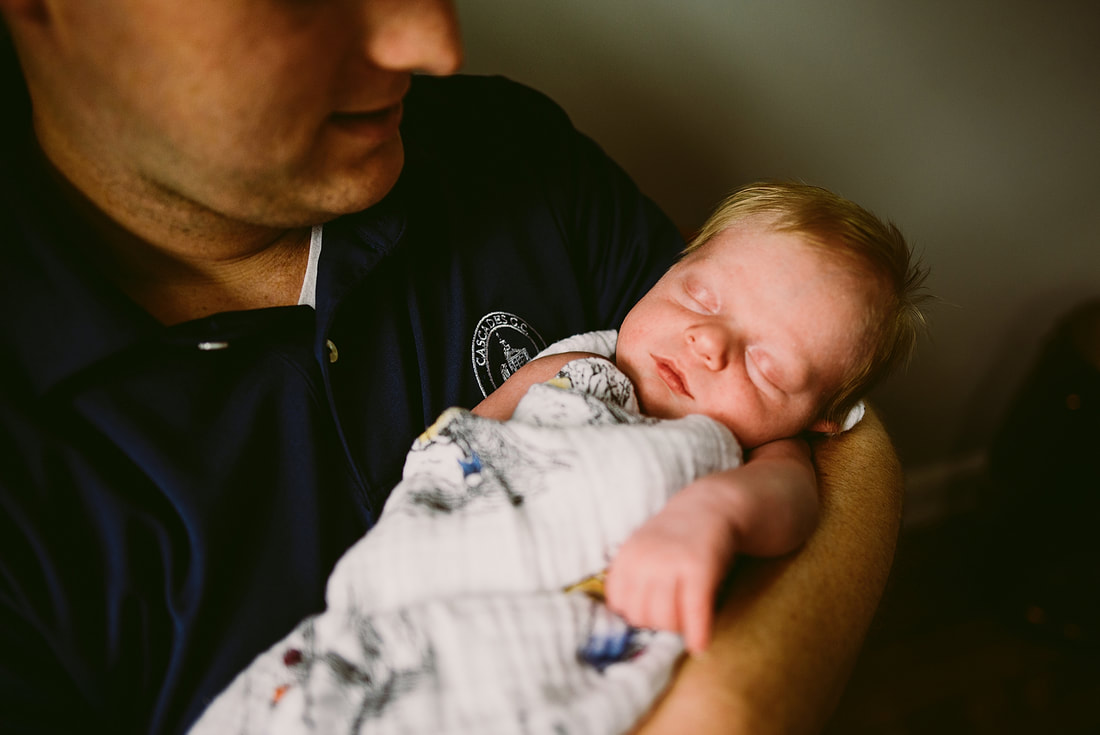 Father-son portrait during a lifestyle newborn session in Charlottesville, Virginia