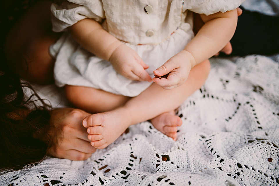 Detail of baby feet and hands during a family session near Charlottesville, Virginia