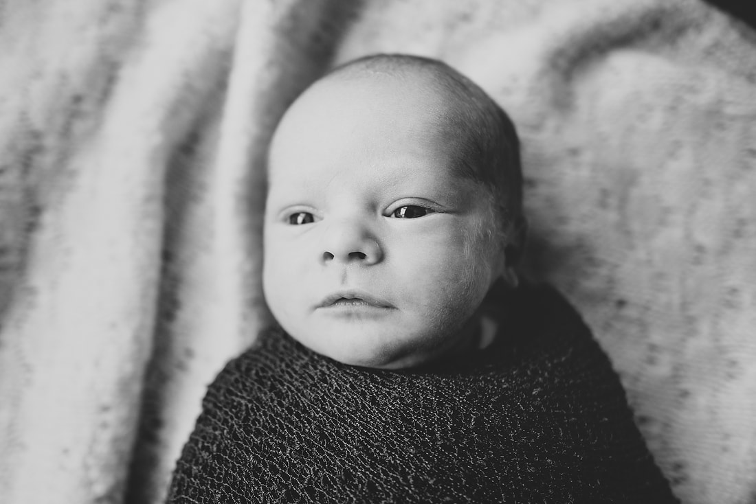 black-and-white newborn portrait during a session at home